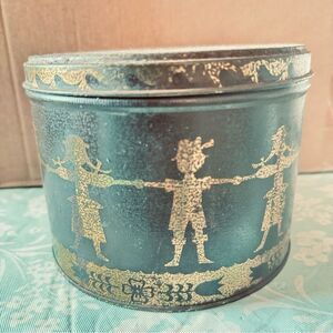 Swiss Miss Vintage Green & gold With children holding hands tin can 1970’s